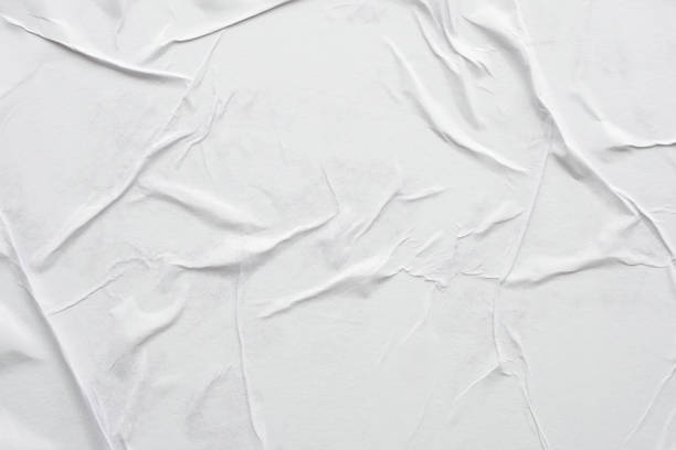 istock Blank white crumpled and creased paper poster texture background 1302890994