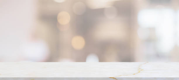 istock marble table top with blurred abstract cafe restaurant interior background 1302891164