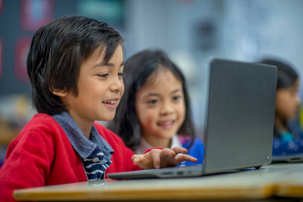istock Sharing the laptop with my friend 1302891471