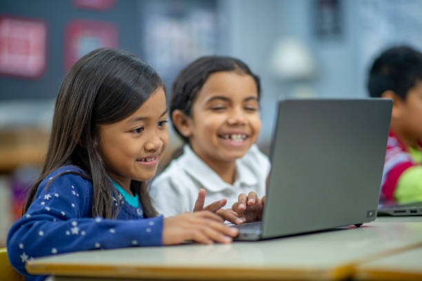 istock Sharing the laptop with my friend 1302891477