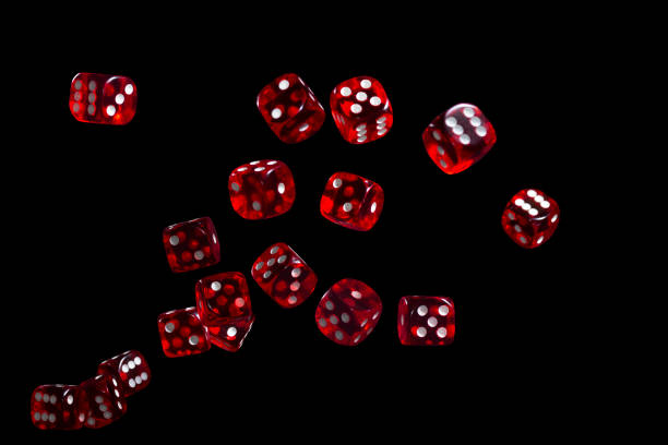 istock Many red dice flying on black background. Gambling concept 1302892641