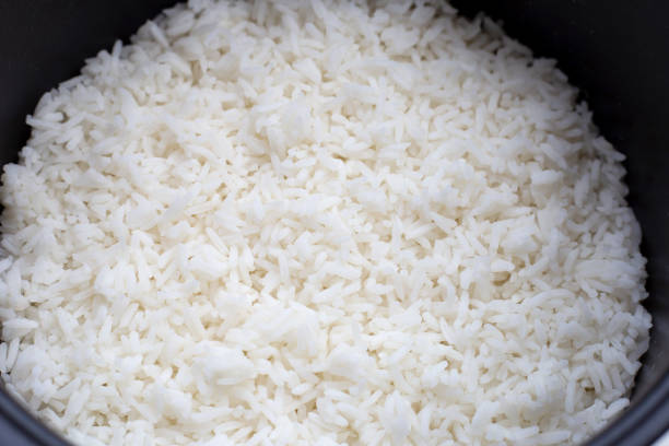 istock Rice in a rice cooker. Top view 1302893393