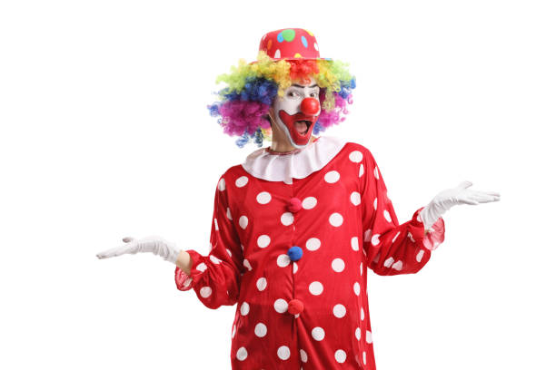 istock Funny cheerful clown standing 1302896433