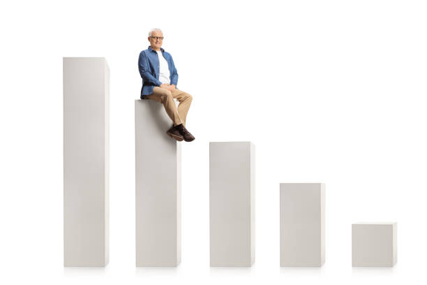 istock Smiling mature man sitting on a graph chart and looking at camera 1302896452