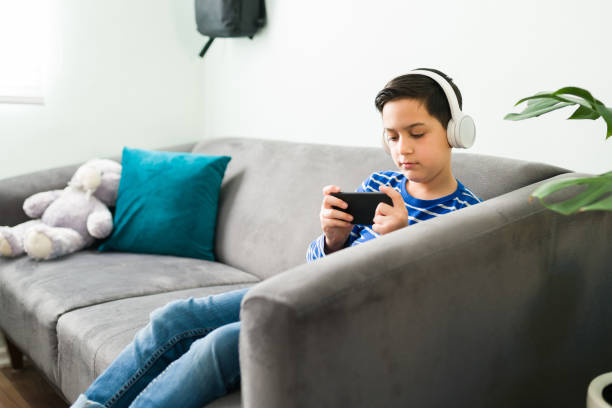 istock Side view of a caucasian boy resting on the sofa 1302898852