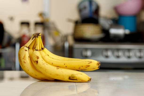 istock Ripe bananas on a kitchen counter. 1302899510