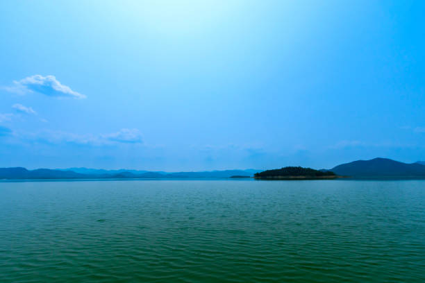 istock The lake scenery with mountains behind under the blue sky 1302900160