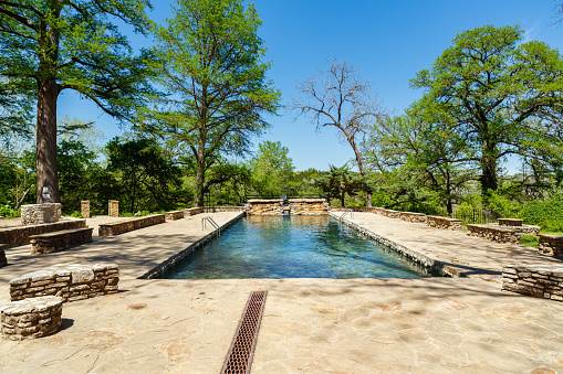 Spicewood, Texas USA - April 5, 2016: Krause Springs is a popular tourist destination with camping and swimming activities in the Texas Hill Country.