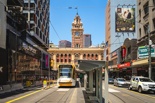 January 1, 2019: tram line in front of the clock tower of Flinders Street railway Station. flinders street station is a station opened in 1854 located at cbd of melbourne, victoria, australia.