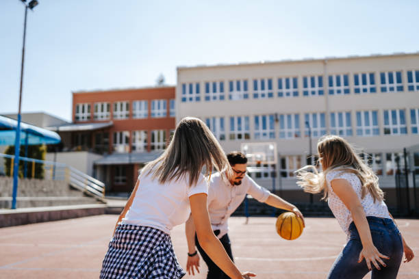 istock Friends playing basketball 1302918452