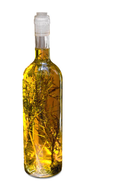 白い背景にハーブと一緒にオリーブオイルのボトル。 - vinegar bottle herb white ストックフォトと画像