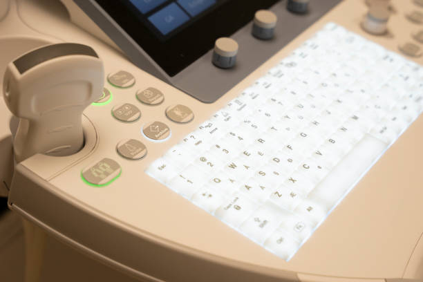 istock Close up on illuminated keys on the keyboard of a sonogram machine. 1302924724