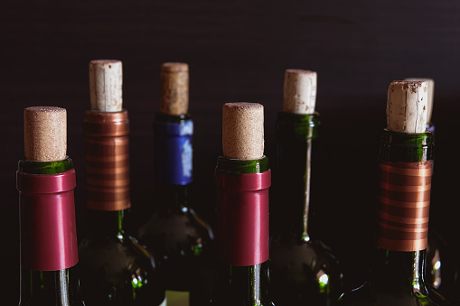 Colorful wine bottles with corks