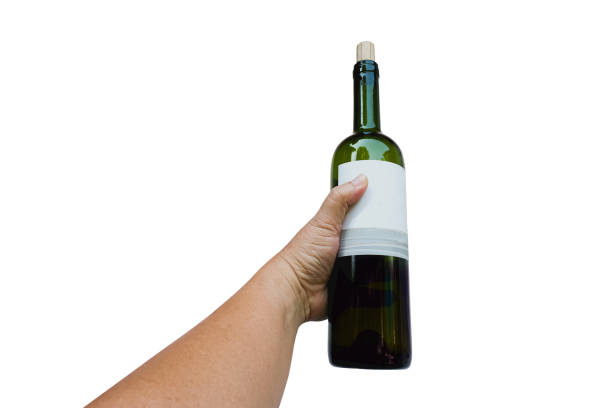 istock Wine bottle in hand for celebration on white background 1302925423