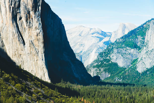 Aerial view overlooking Yosemite Valley and the El Capitan and Half Dome. High alpine mountains and deep forests.