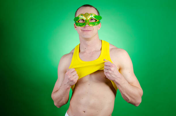 istock Carnival. Holidays and weekends. Young sexy man. 1302927077