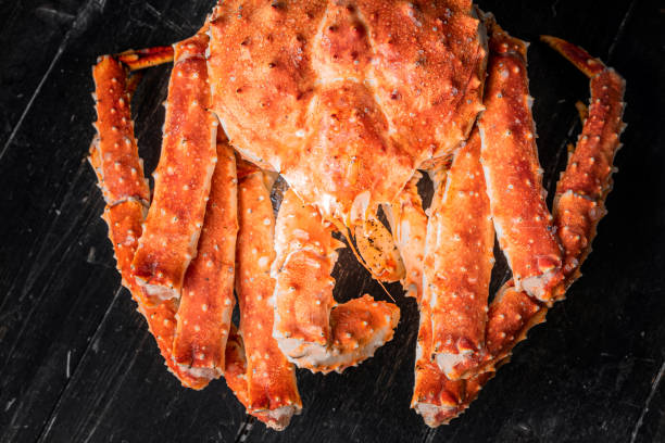 istock Tasty king kamchatka crab on wood board 1302927986