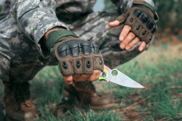 istock A man with a knife in the forest 1302928859