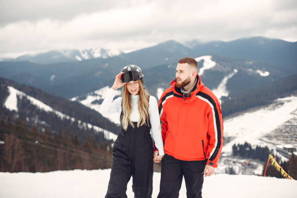 istock Winter snow couple in a mountains 1302929227