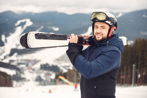 istock Man snowboarding in the mountains with the snowboard 1302929229