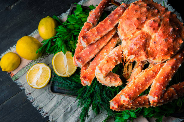 istock Tasty king kamchatka crab with lemon slices 1302930239