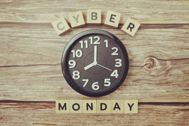 istock Cyber Monday with clock on wooden background 1302935005