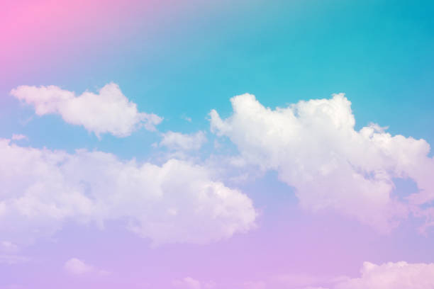 istock beauty soft pastel with fluffy clouds on sky. multi color rainbow image. love pink light. 1302935025