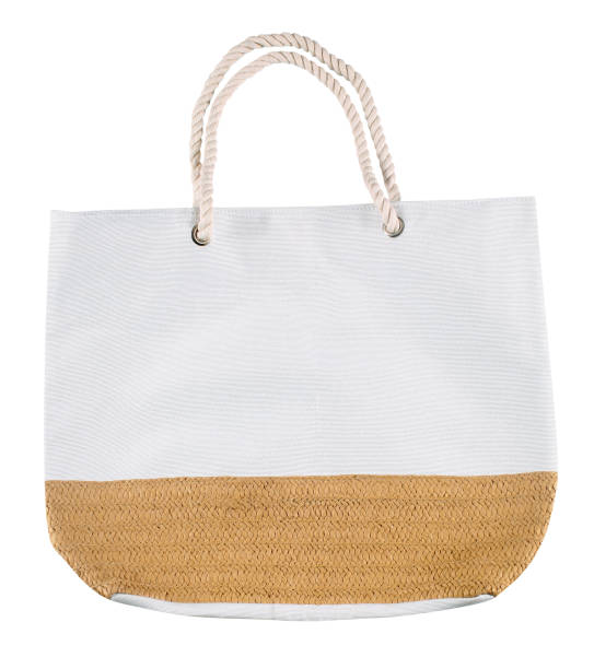 White fabric beach bag with wicker detail and rope handles