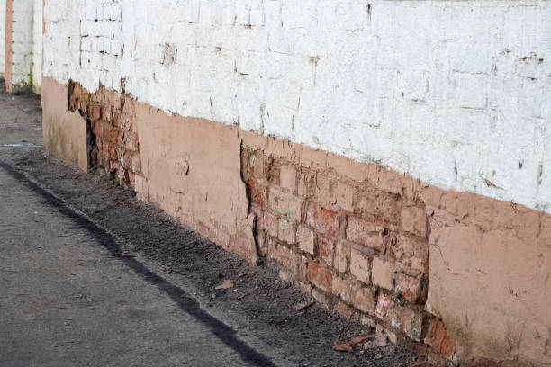 istock Old sprinkled exterior brick wall close up 1302937871