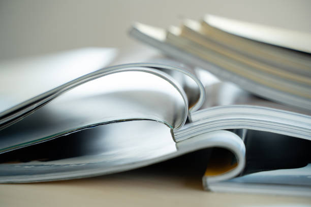 istock publication Newspaper and journal books background and catalog design article magazine press Newspaper with tablet 1302937902