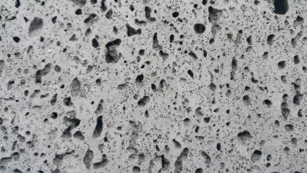 istock Grey color floor background with drak grey hole shapes 1302937949