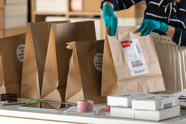 istock Preparing paper bags with labels for shipping 1302938215