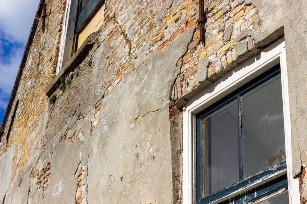 istock Old damaged abandoned buildings with broke glass 1302938821