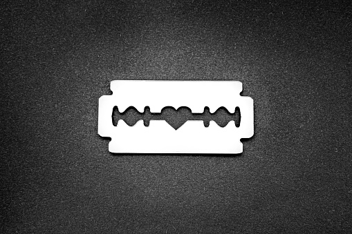 Razor blade with a heart-shaped opening in the middle