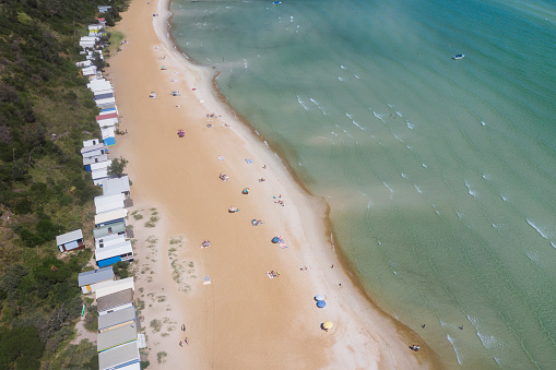 Aerial image captured at Mt Martha, Victoria on the Mornington Peninsula, Victoria on a beautiful summer's day featuring iconic beach huts.