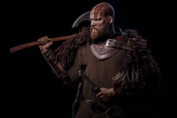 istock Weapon wielding viking warrior in studio shot 1302941513