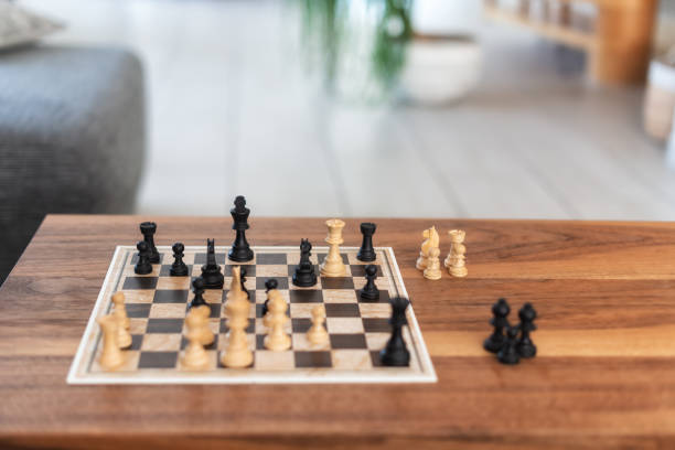 istock playing chess at home on wooden table 1302941515
