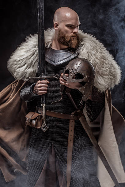 istock Weapon wielding viking warrior in studio shot 1302941574
