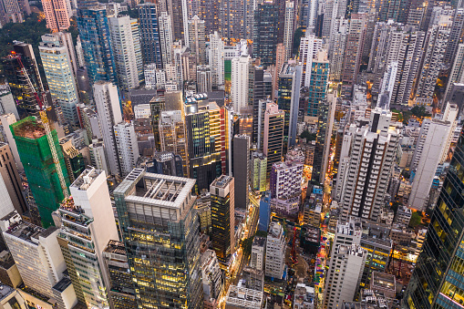 Aerial view of the overcrowded Central business district in Hong Kong island mixing office buildings and tall apartment towers in Sheung Wan.