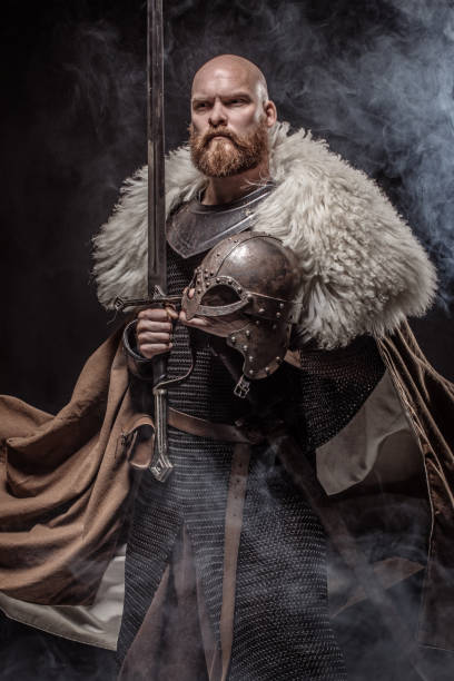 istock Weapon wielding viking warrior in studio shot 1302941975