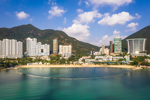 Stunning view of the famous Repulse bay beach and waterfront luxury condominium tower in the south of Hong Kong island. This is one of the most popular beach for swimming in the island
