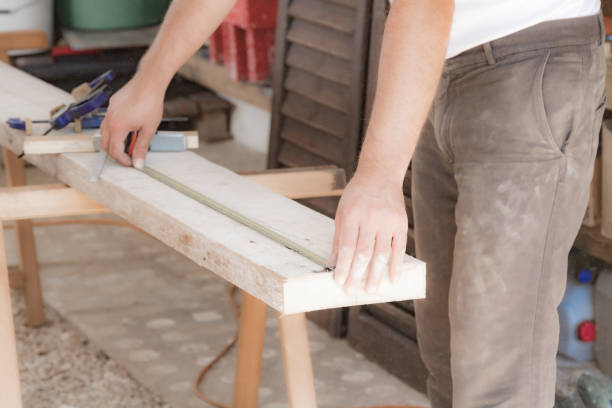 istock Male carpenter working with wood material in a garage. 1302942819