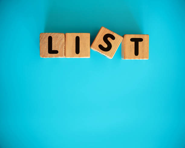 istock LIST with toy block on blue background 1302944218