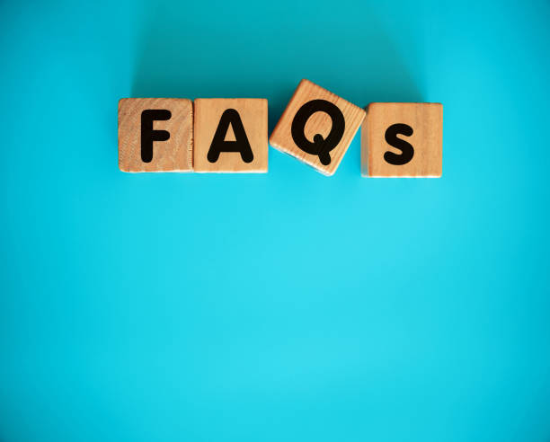 istock FAQS with toy block on blue background 1302945321