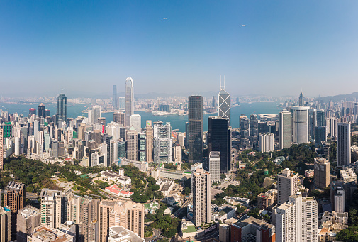 Hong Kong viewed from the drone with city skyline of crowded skyscrapers.