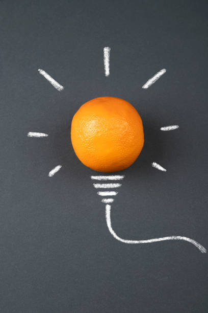 Light bulb made of orange fruit