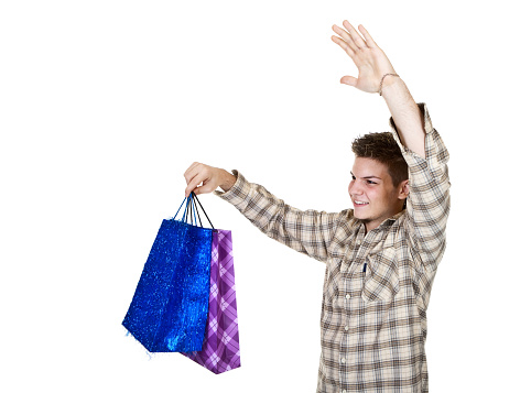 Young man with shopping bag isolated