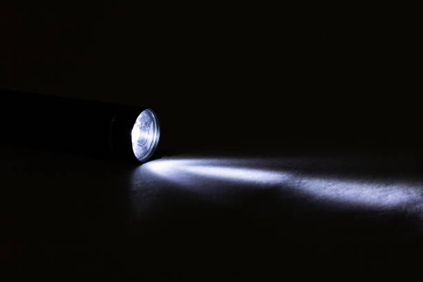 istock Blue light of a flashlight in the dark 1302952085