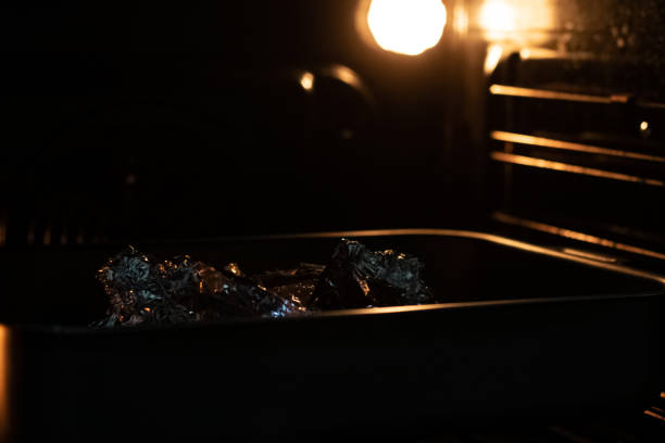 istock Oven in foil in a baking sheet 1302952277
