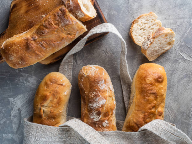istock Baguettes In A Bag On Gray Background 1302953407